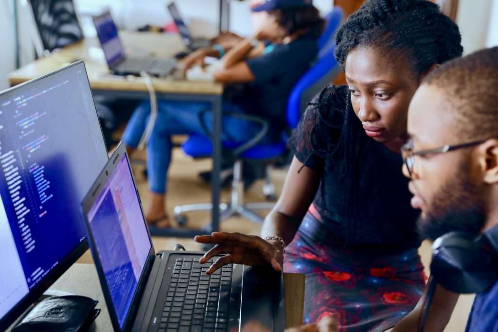 two developers looking at laptop