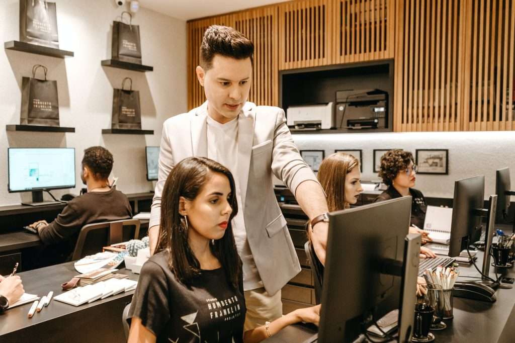 woman and man in front of pc