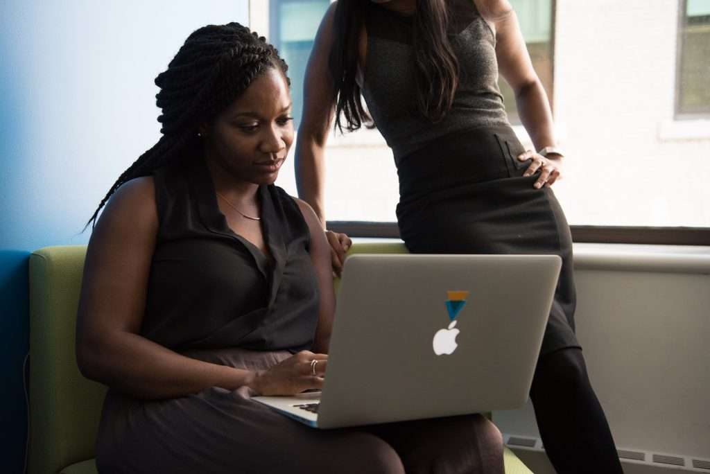 woman using macbook silver