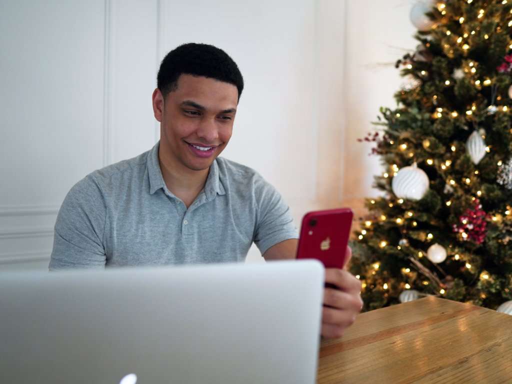 Man with laptop and phone